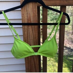 Urban Outfitters out from under green bikini top